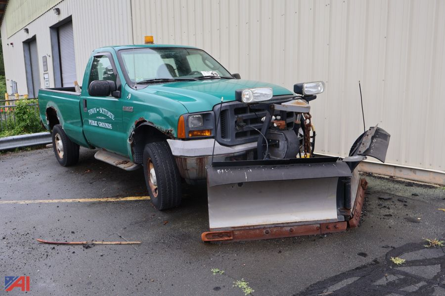 Ford F-250 Super Duty pickup with plow, green crew cab, front-mounted snow plow and utility lights