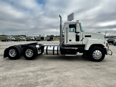 Mack PI64T conventional daycab truck side view showing chassis and fuel tanks