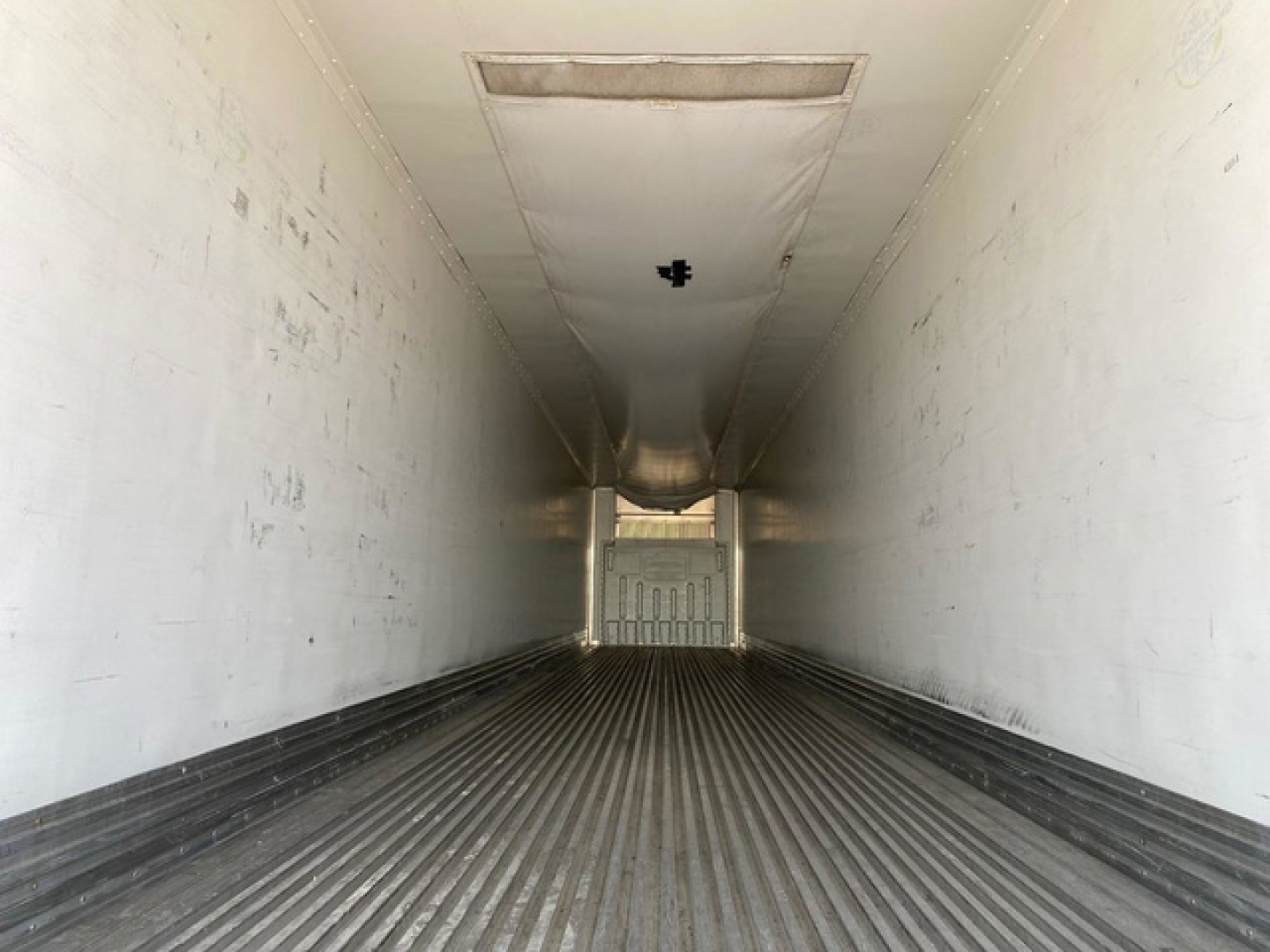 Great Dane reefer trailer interior empty cargo area with ribbed floor and rear doors.