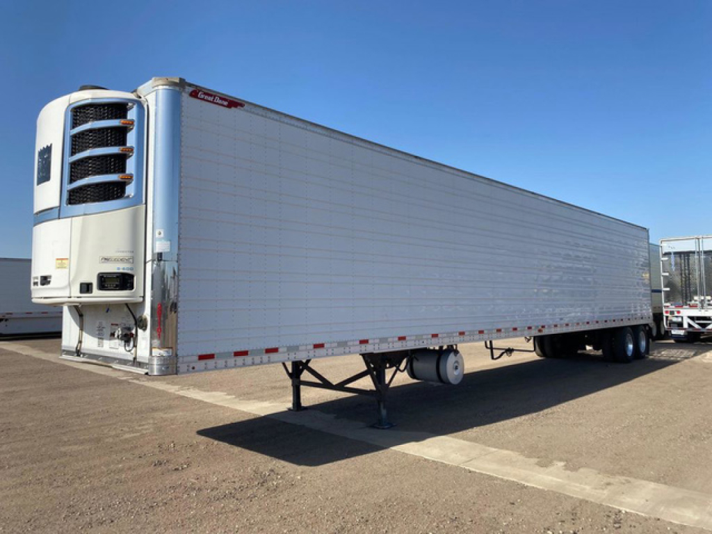 Great Dane reefer trailer with front-mounted refrigeration unit showing exterior side panels and dual rear axles.