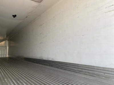 Great Dane reefer trailer interior showing insulated white panels and ribbed flooring with a long empty cargo area.