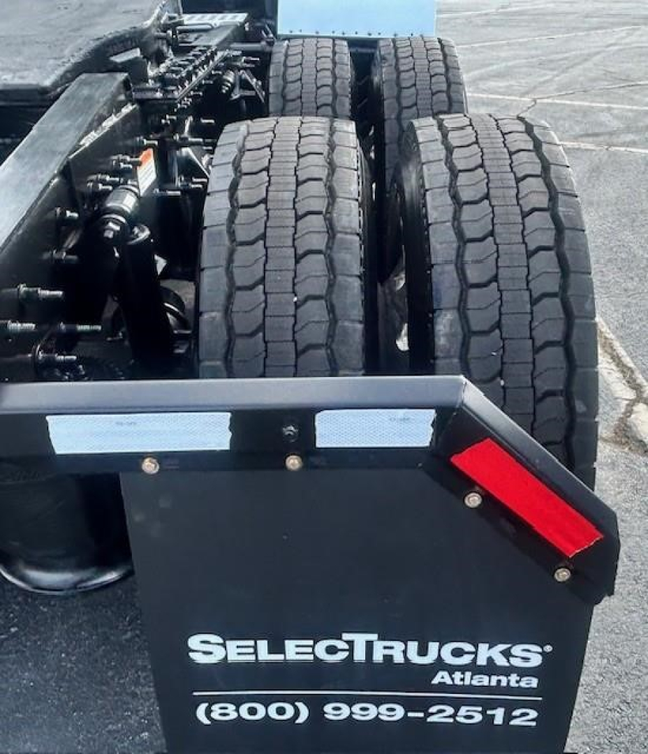 Rear view of a 2022 Freightliner Cascadia 126 truck chassis showing dual rear tires and SelectTrucks Atlanta branding on the mudguard.