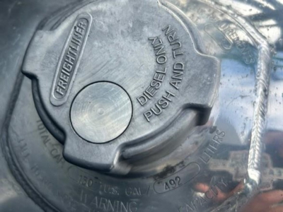 Freightliner diesel fuel cap showing 'FREIGHTLINER' and 'DIESEL ONLY PUSH AND TURN' along with capacity markings.