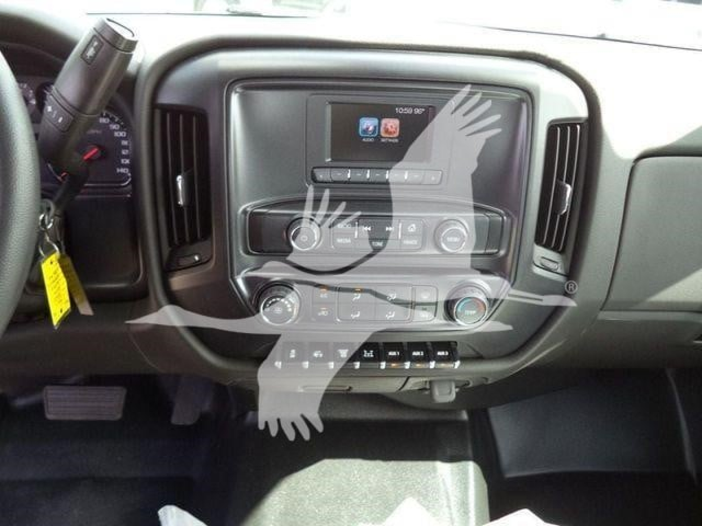 Interior dashboard of a 2023 International CV showing central touchscreen, HVAC controls, and steering column with keys.