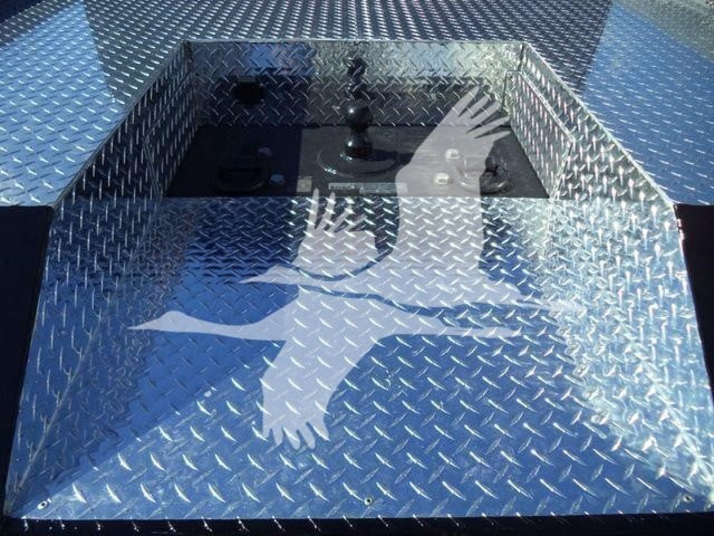 Diamond plate toolbox on a new International CV tote truck bed with stake pocket and latch panel