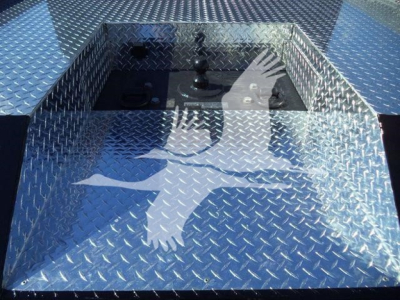 Diamond plate toolbox on a new International CV tote truck bed with stake pocket and latch panel