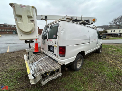 Bucket truck van with mounted scissor lift platform rear view showing utility markings and ladder rack
