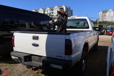 Ford F-250 Super Duty pickup truck rear view with equipment in bed