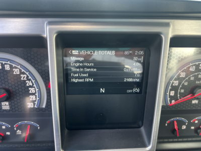 Dashboard display showing vehicle totals including mileage and engine hours for a 2026 Mack GR64B cab and chassis.