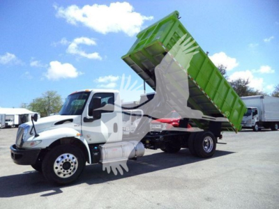 Dump truck with green dump bed raised on a white International MV chassis showing VIN 3HAEUMML1LL198791 and stock T98791.