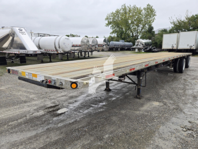 Flatbed trailer with wooden deck and dual rear axles in a yard, stock number 7857, Utility Combo 2016 model.