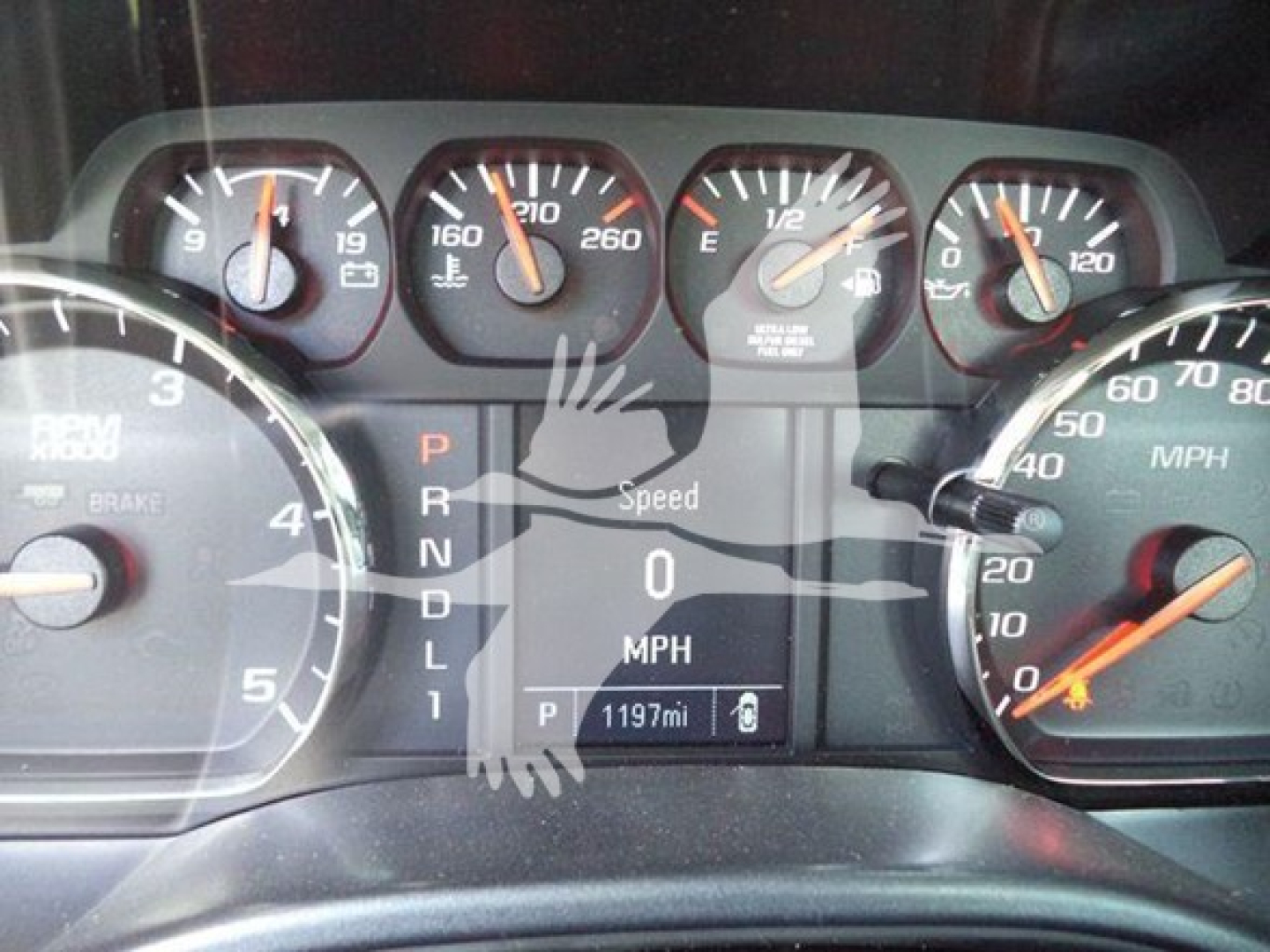 Dashboard of 2023 International CV Rollback showing gauges and gear selector. Visible text includes PRNDL1 on gear display, Speed 0 MPH, P 1197mi, and various gauge markings.