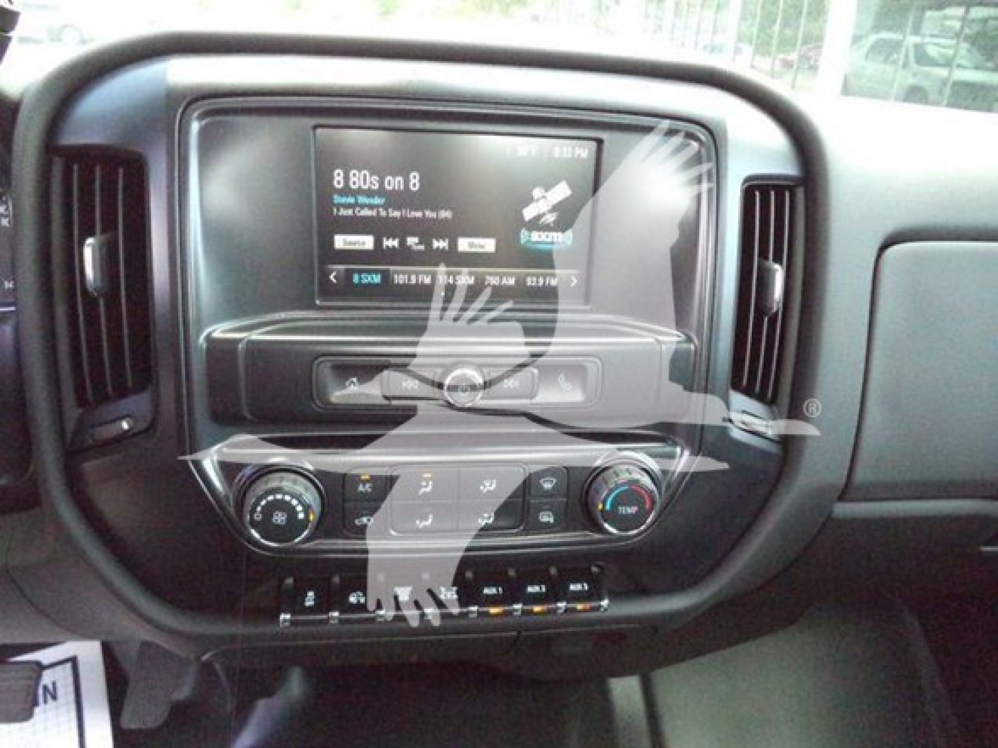 Dashboard of a 2023 International CV showing an infotainment screen, climate controls, and control buttons. Visible text includes vehicle info and system labels on the display.