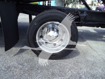 Wheel and tire assembly on a 2023 International CV rollback truck chassis showing a polished steel rim.
