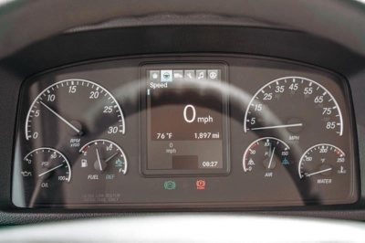 Dashboard display showing 0 mph, digital speed readout, center screen with 1,897 mi and 08:27, left gauges for RPM and fuel, right gauges for air and water, plus warning icons.