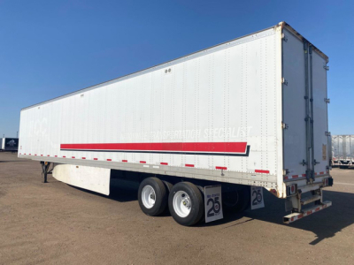 Stoughton 2014 used van trailer side view showing white dry van with red diagonal stripe and dual rear doors, 25 low-profile mudflaps, two axles, chrome wheels.