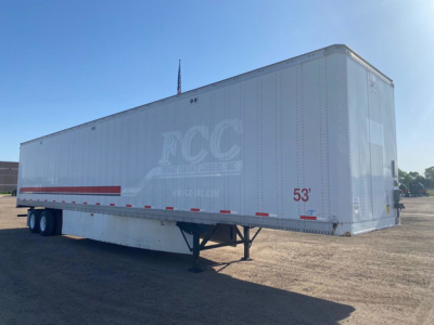 Image of a 53' Stoughton van trailer with FCC logo, white exterior, dual rear wheels, and support legs visible.