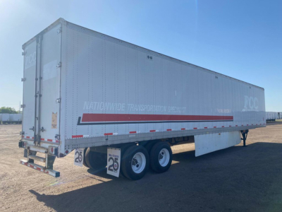 Stoughton van trailer side view with DOT markings and rear doors. Visible text includes NATIONWIDE TRANSPORT maybe and red stripe along side.