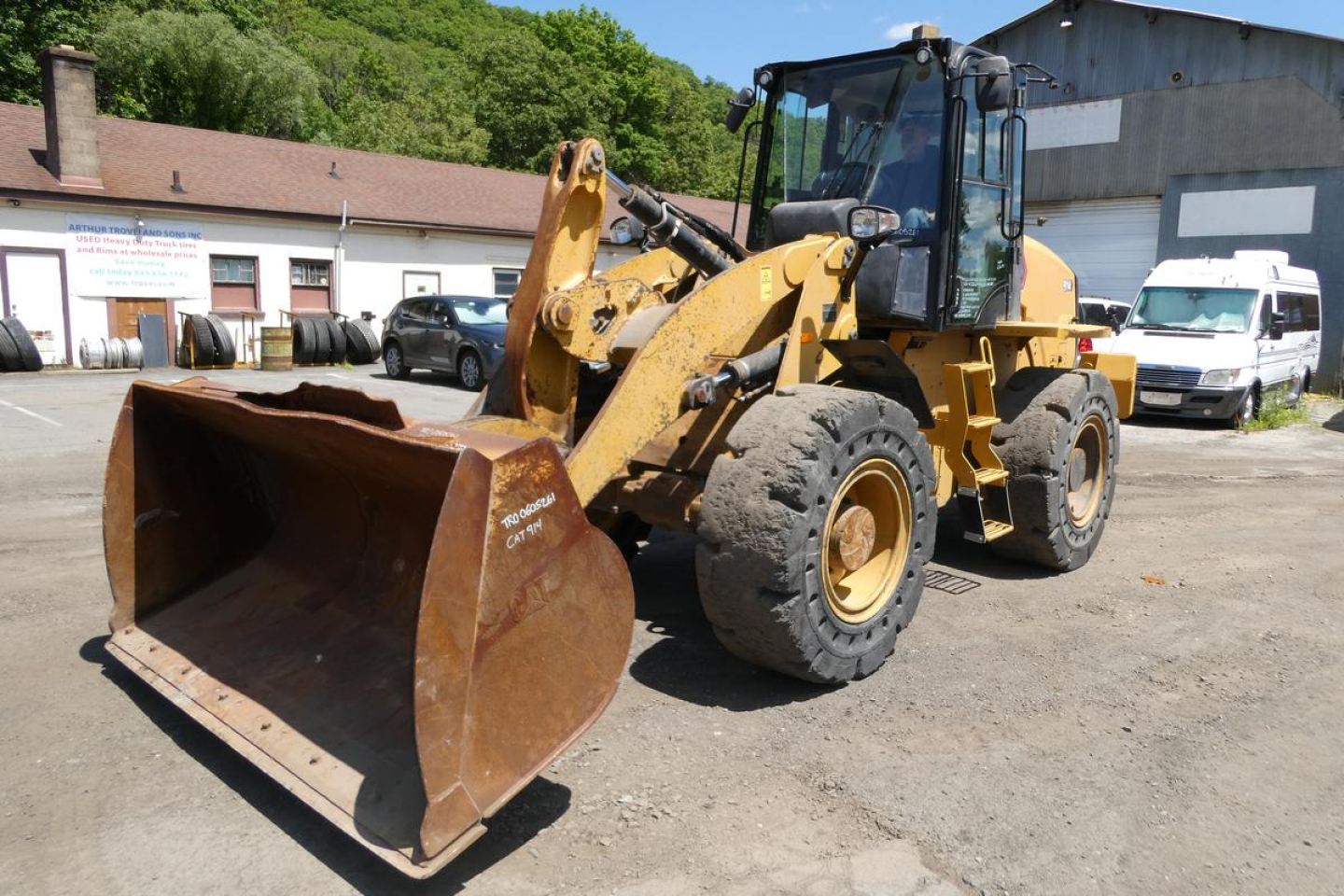 2022 Caterpillar 914 wheel loader in-service showing front bucket and hydraulic arm assembly with cab and tires.