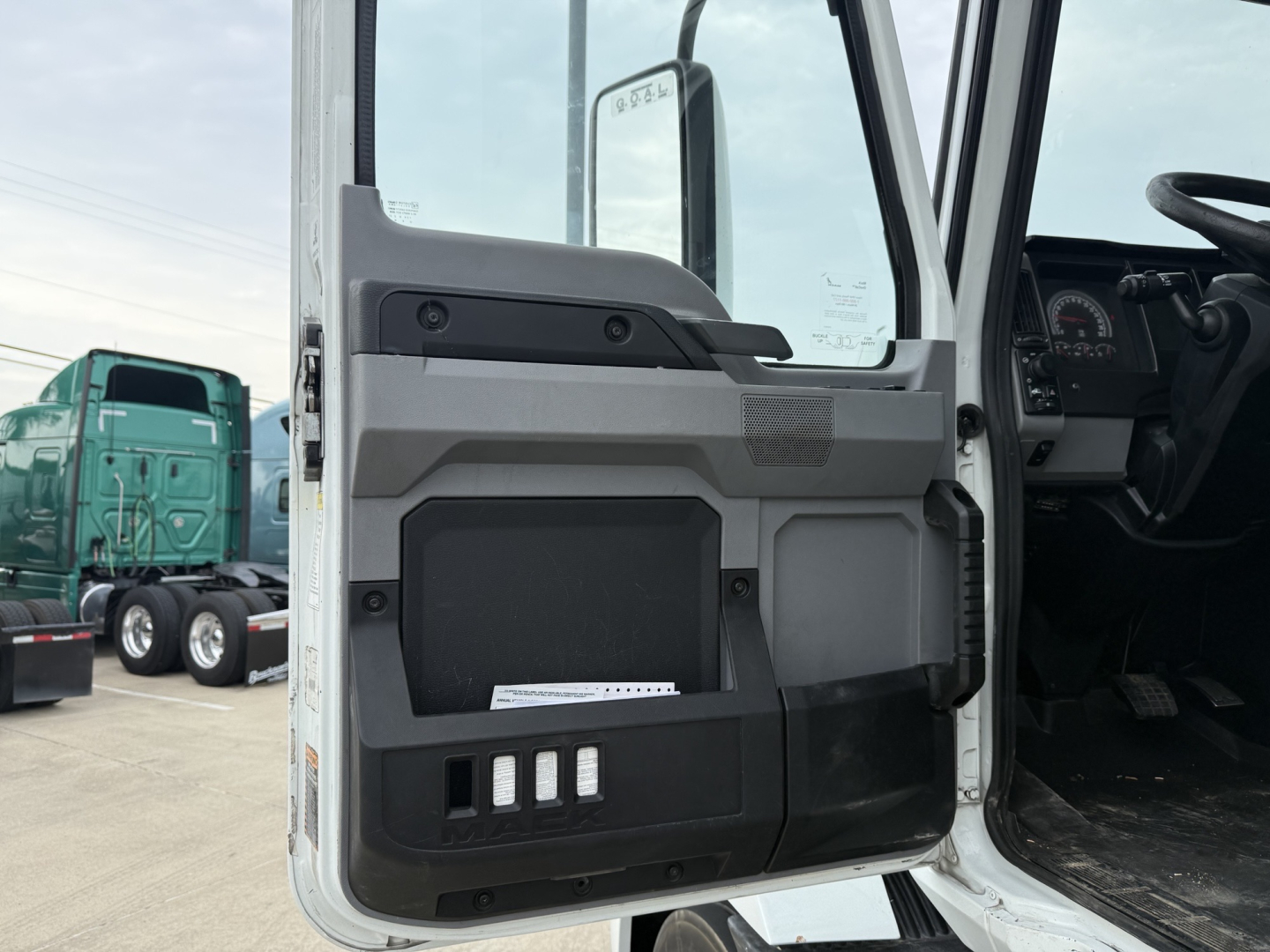 Cabin door interior panel with storage pocket and control buttons visible.