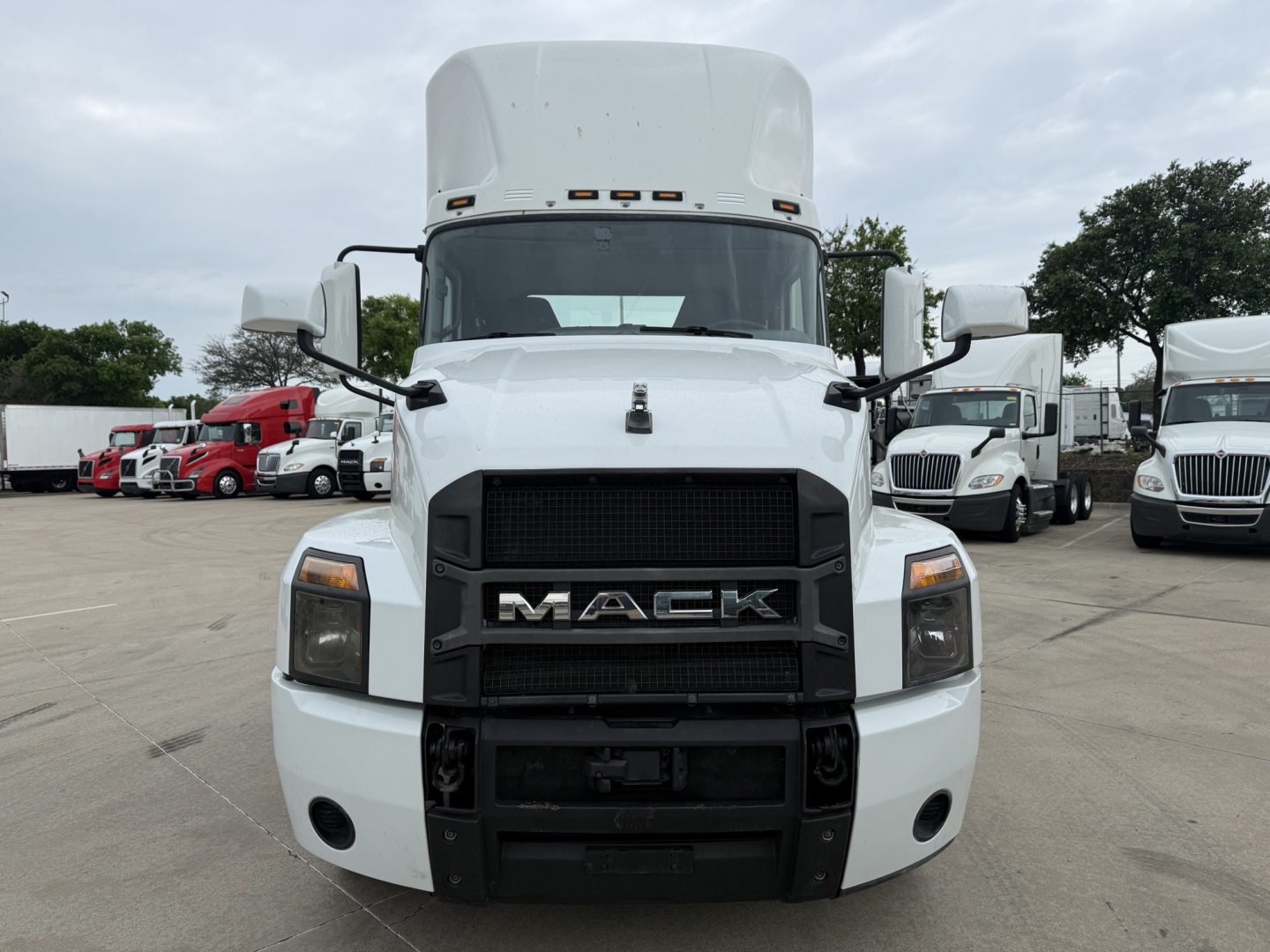 White 2022 Mack AN42T daycab truck front view showing Mack logo grille and headlights.