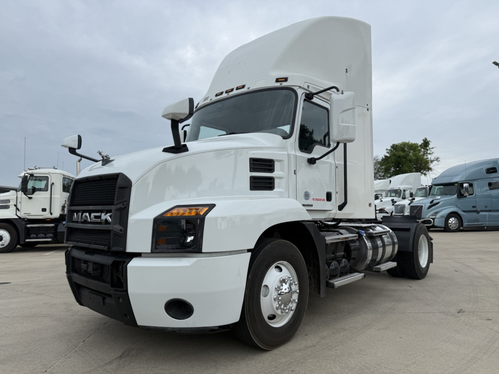 Truck: 2022 Mack AN42T daycab with sleeper, white exterior, front grille, dual tires, and side fuel tanks visible.