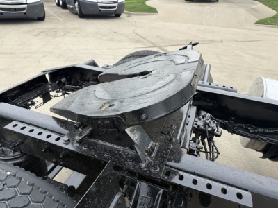 Tractor-trailer chassis off of a 2022 Mack AN42T showing the central fifth wheel and frame rails with visible hardware.