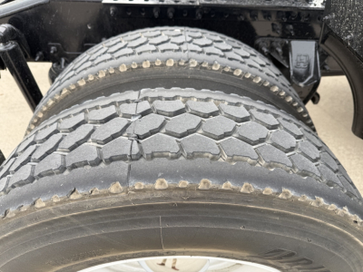 Front dual rear tires on Mack AN42T truck showing tread pattern and sidewall details.