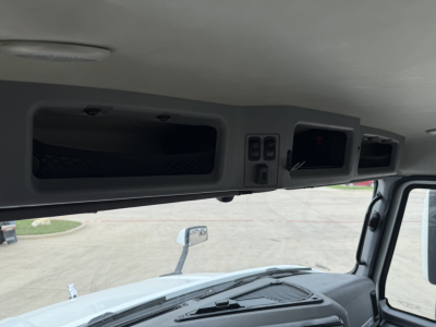 Mack AN42T interior view showing overhead storage compartments and dash area