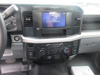 Dashboard of a 2025 Ford F-550 showing infotainment screen, steering wheel, climate controls, and center console.