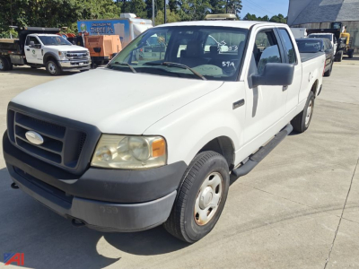 Ford F-150 extended cab pickup truck front-left view, white exterior, black grille, running boards, 4x4 badge, in a car lot.