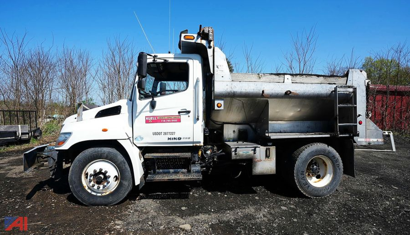Hino 338 4x2 dump truck side view with dump bed and chassis
