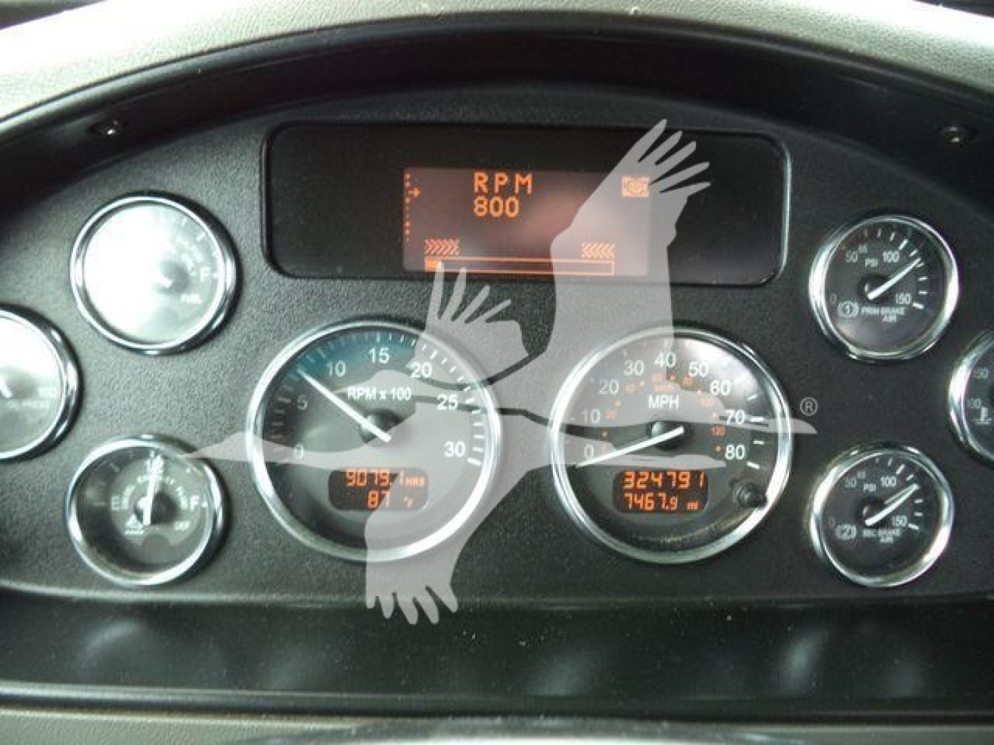 Peterbilt 348 instrument cluster dashboard showing RPM gauge, speedometer, and digital readouts.