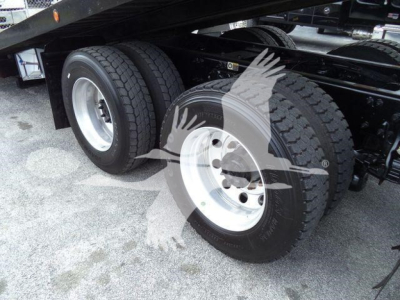 Peterbilt 348 rollback truck rear dual tires and chassis view showing dual rear axles and fuel/air lines