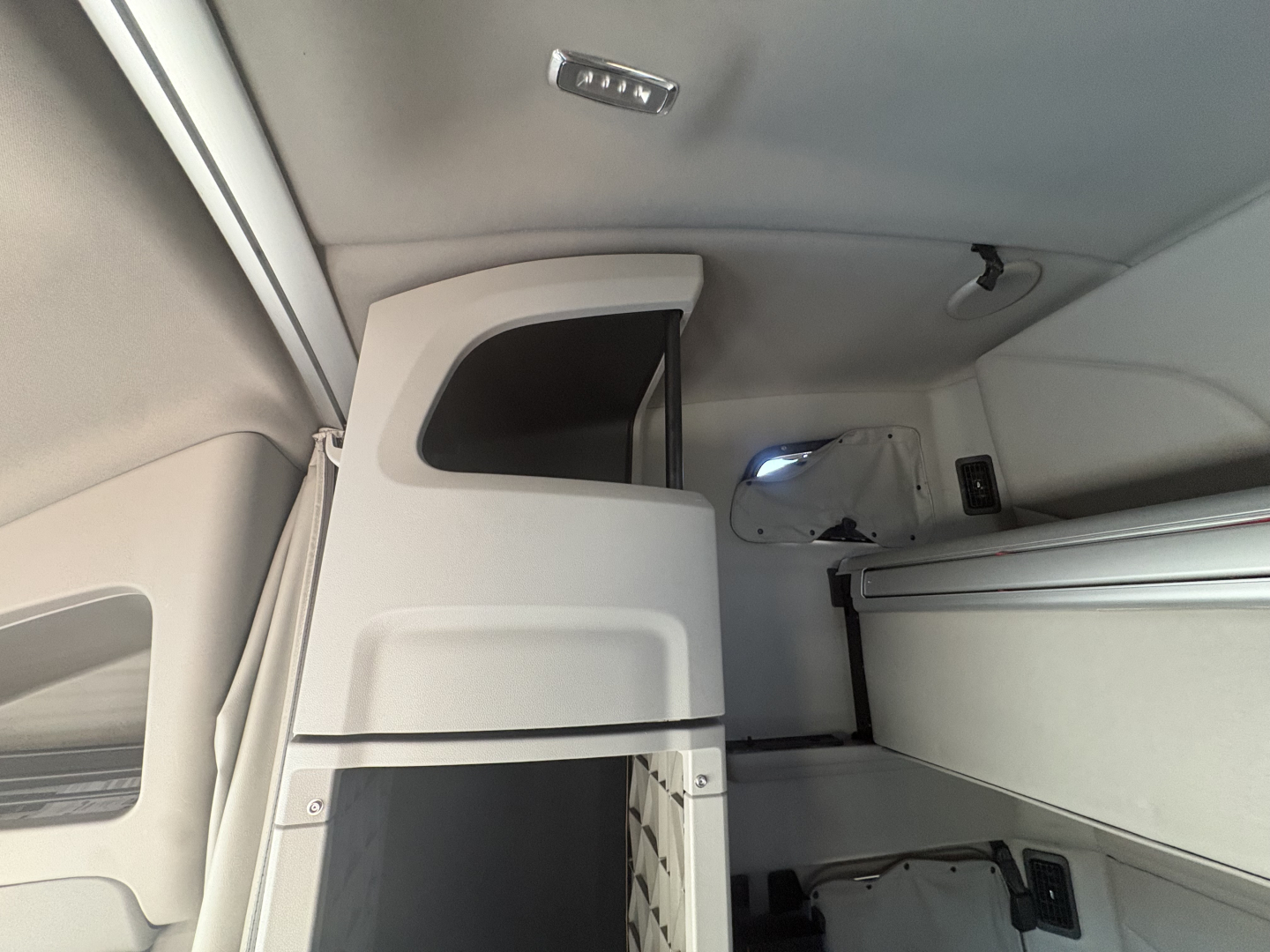 Peterbilt 579 interior view showing sleeper cab and storage compartments.