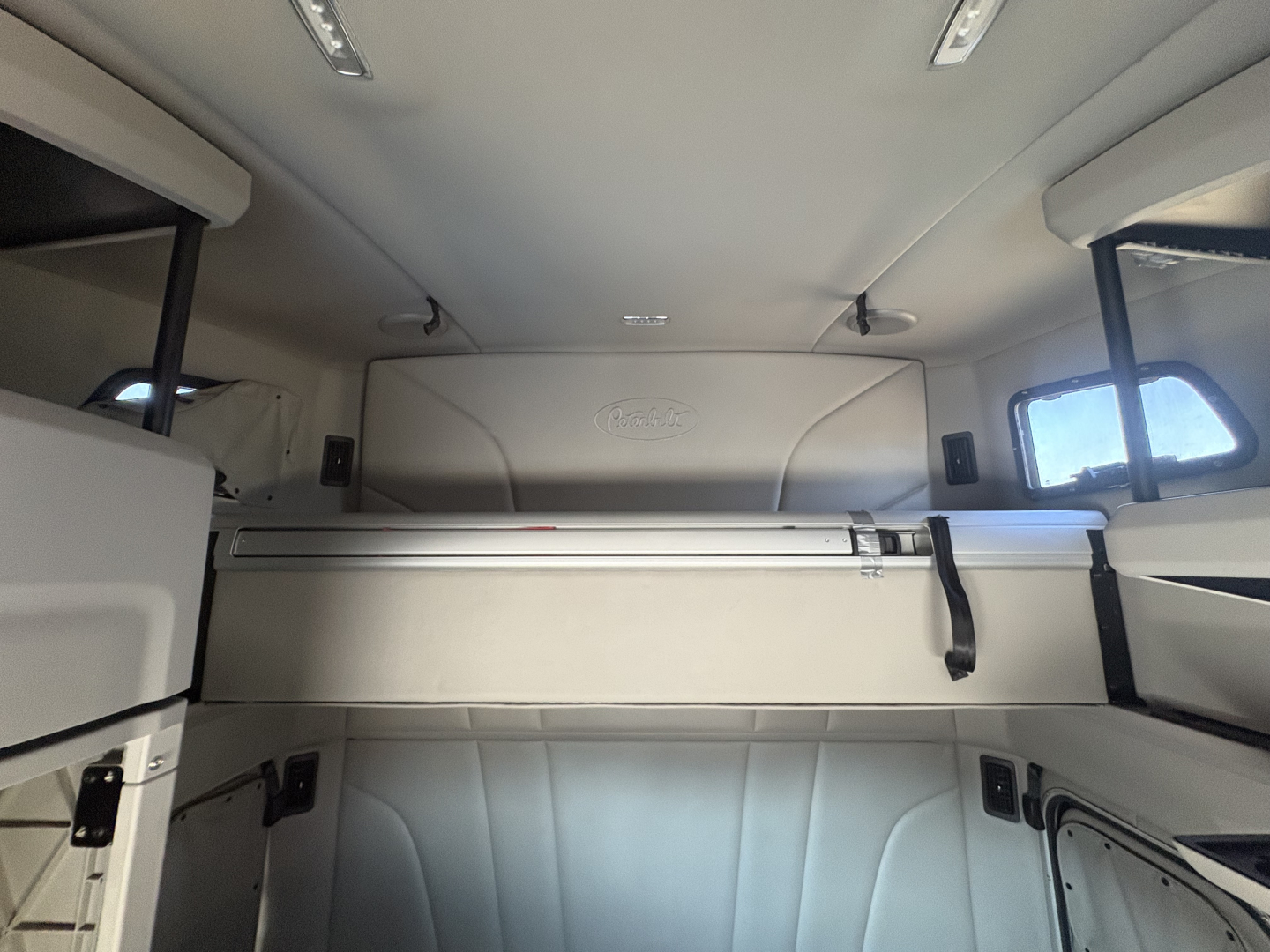 Peterbilt 579 sleeper cab interior showing storage shelf and side panels