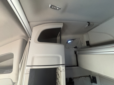 Peterbilt 579 interior view showing sleeper cab and storage compartments.
