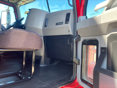 Cab interior of a 2020 Mack AN64T70 truck showing dash area, steering column, and passenger seat with Afnson/ Mack branding panel visible.