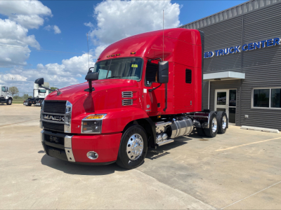 Red Mack AN64T70 truck in service view showing cab and dual rear axles