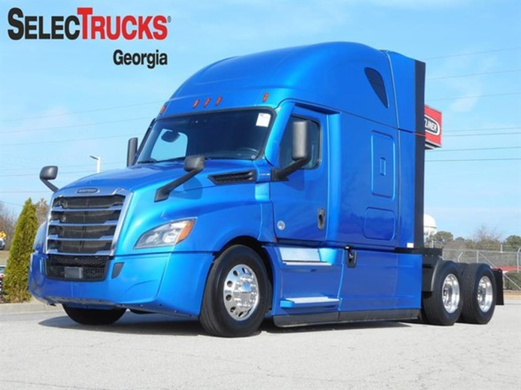 Blue Freightliner Cascadia 126 tractor-trailer in-view with SelectTrucks Georgia logo