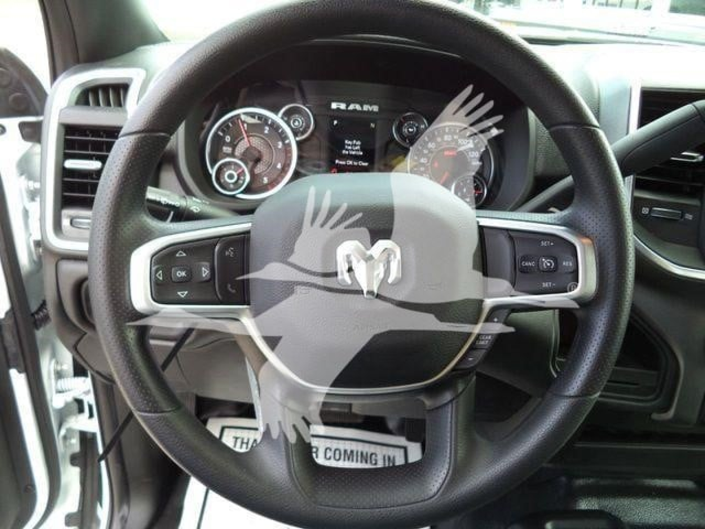 Ram 5500 dashboard and steering wheel showing instrument cluster and Ram logo on steering wheel.