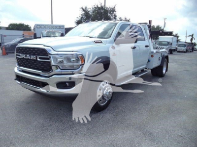 Ram 5500 truck in white with dual rear wheels, front grille with RAM lettering, heavy-duty bumper, and a winch-equipped category.