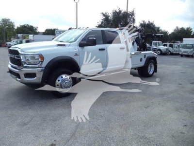 Ram 5500 towing truck shown from front-left角 with winch system and flatbed, 2024 model year