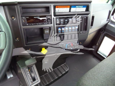 MD6 truck cab interior showing dashboard with radio, control switches, and climate controls.