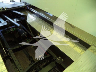 MD6 truck chassis with inspection walk surface showing metal diamond tread with equipment rails and control linkages.