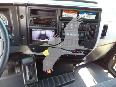 Mack MD6 dashboard and center console showing radio, screen, and control panels.