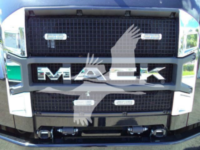 Mack MD6 front grille with large 'MACK' lettering and badges on the grille, showing the truck's front view.