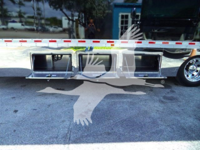 Truck side showing underbody storage compartments on Mack MD6 rollback bed with multiple aluminum drawers.