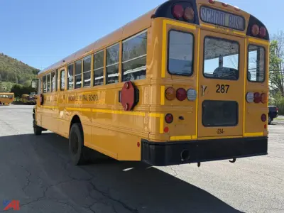 Yellow IC Corporation CE Series school bus rear view showing school bus number 287 and rear lights.
