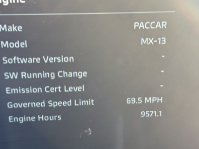 Vehicle instrument cluster screen showing engine data: Make PACCAR, Model MX-13, Governed Speed Limit 69.5 MPH, Engine Hours 9571.1, no software version or SW changes listed.